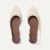 The Almond Slingback in Eyelet Ivory shown from the top.