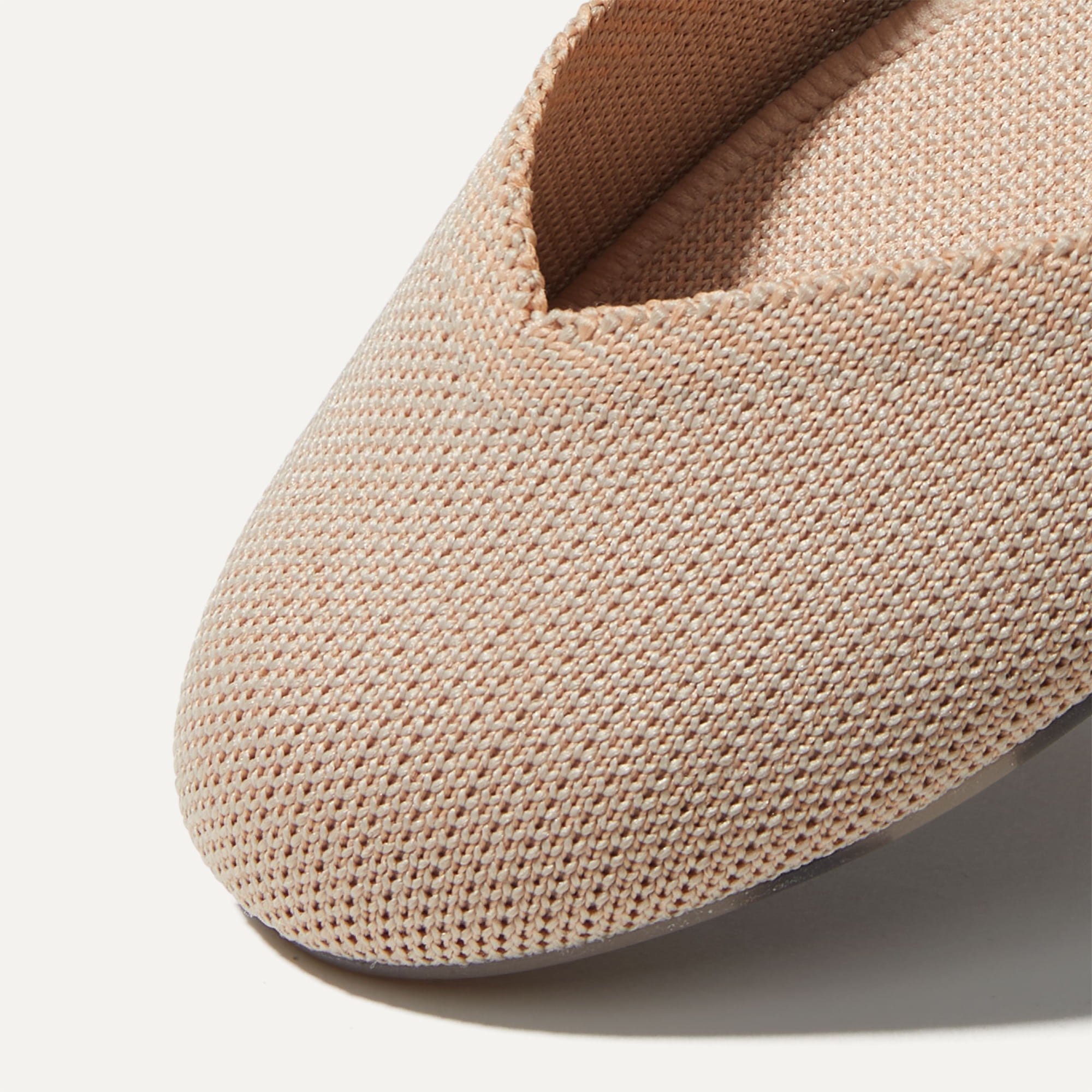 The Flat round toe shoe in Ecru shown from the top view with detailing of the front of the shoe.