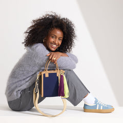 Model wearing The Crossbody Strap in Gold Dust paired with The Petite Classic Tote.