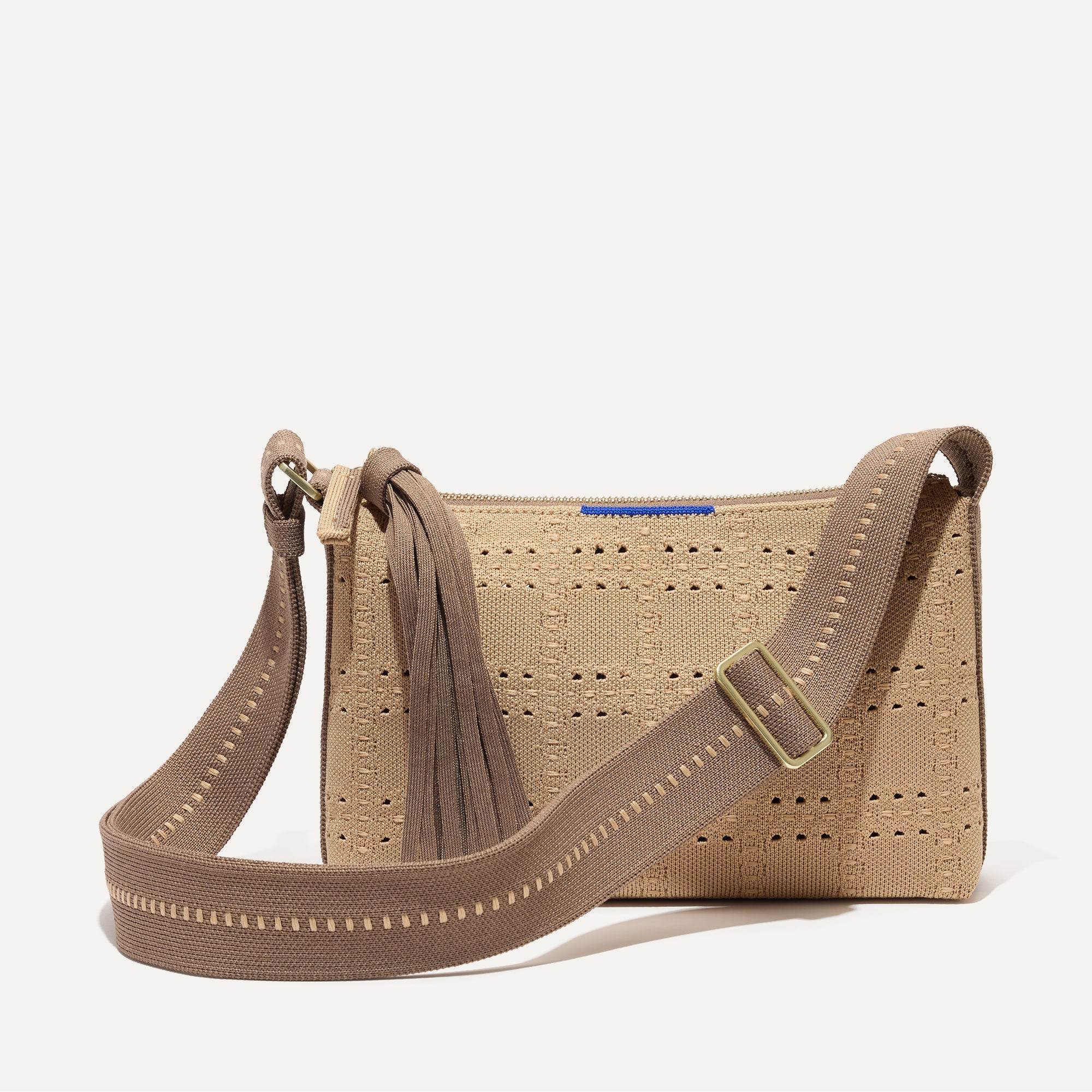 PDP |The Casual Crossbody in Brown Perf, shown from the front.