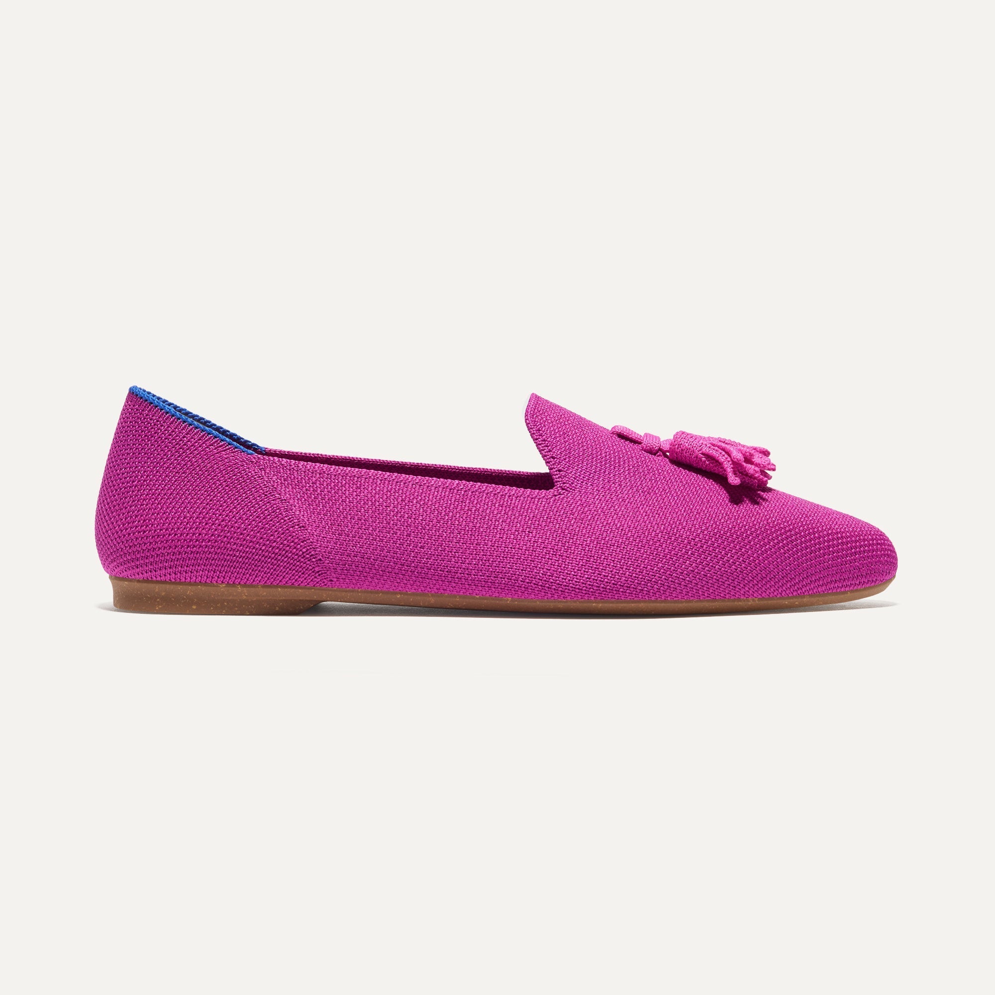 The Almond Tassel Loafer in Pink Bramble shown from the side.