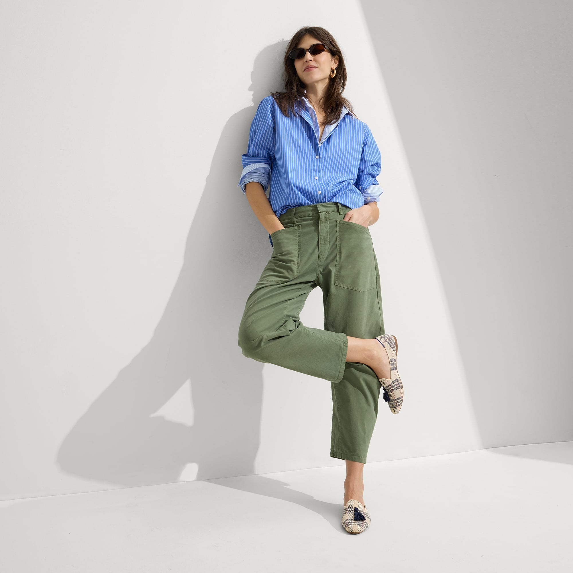 Alternate view of a model wearing The Almond Tassel Loafer in Spring Plaid.