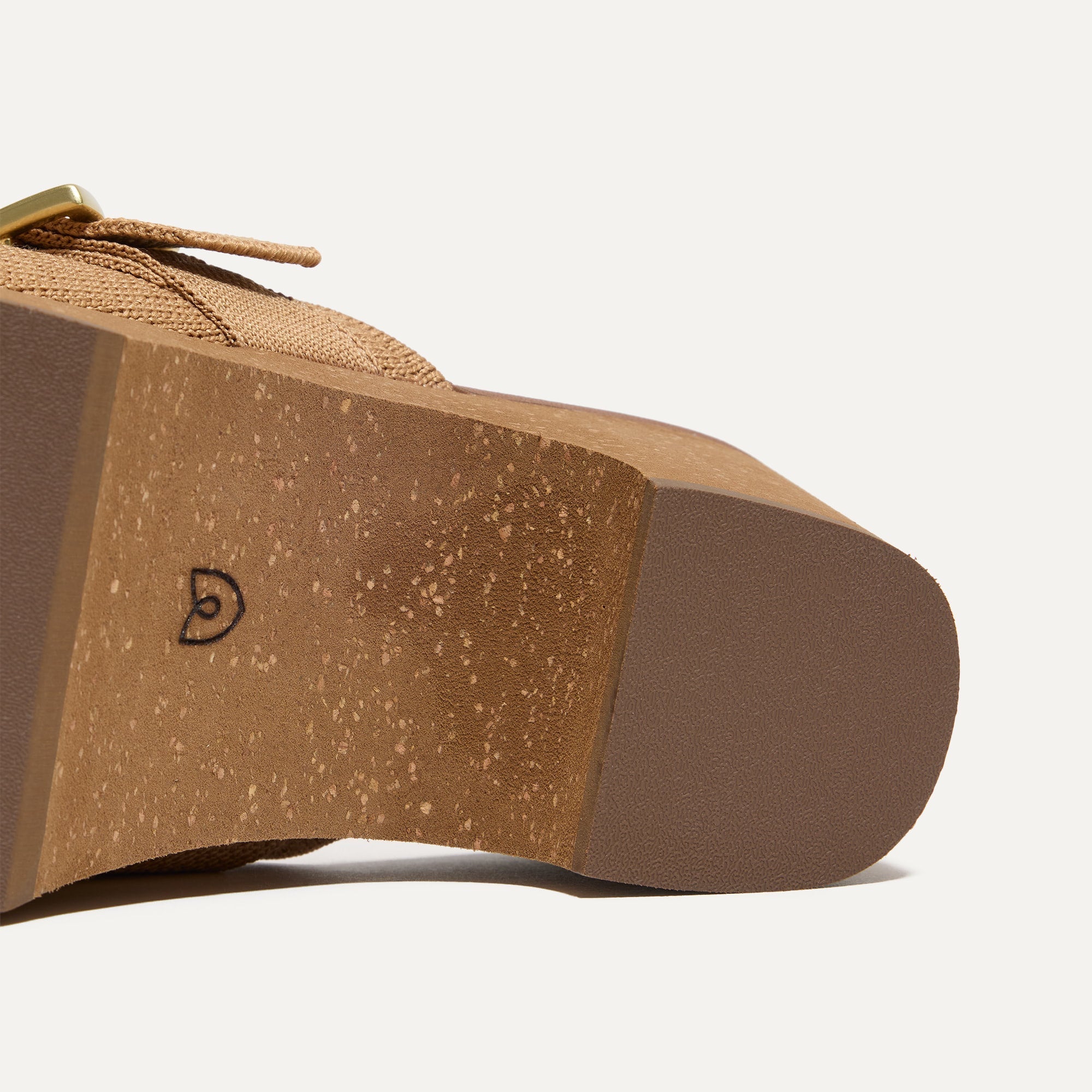 Close up of the outsoles of The Classic Clog in Butternut.