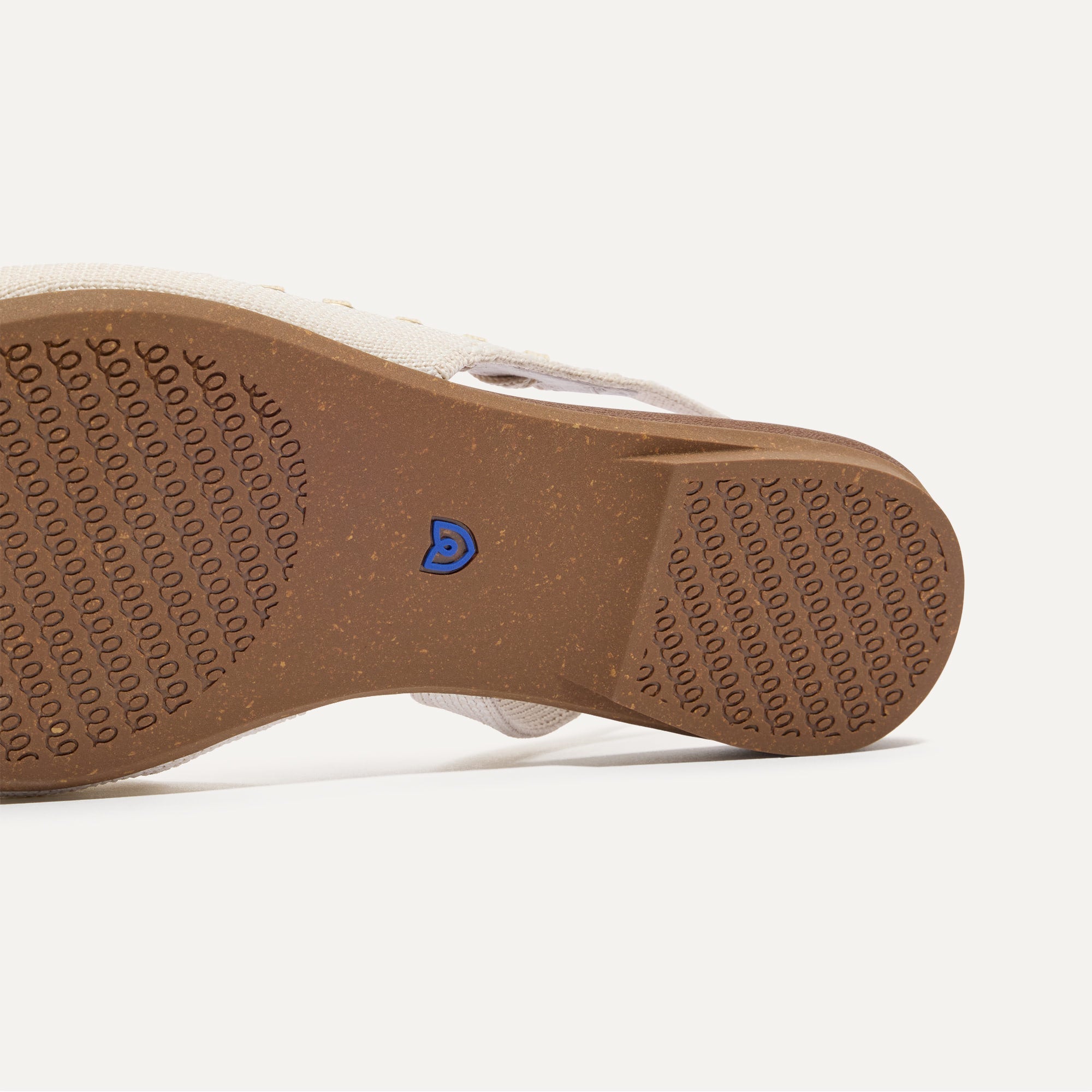 Close up of the outsole of The Almond Slingback in Eyelet Black.