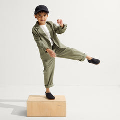 Alternate view of a child wearing The Kids Clog in Black.