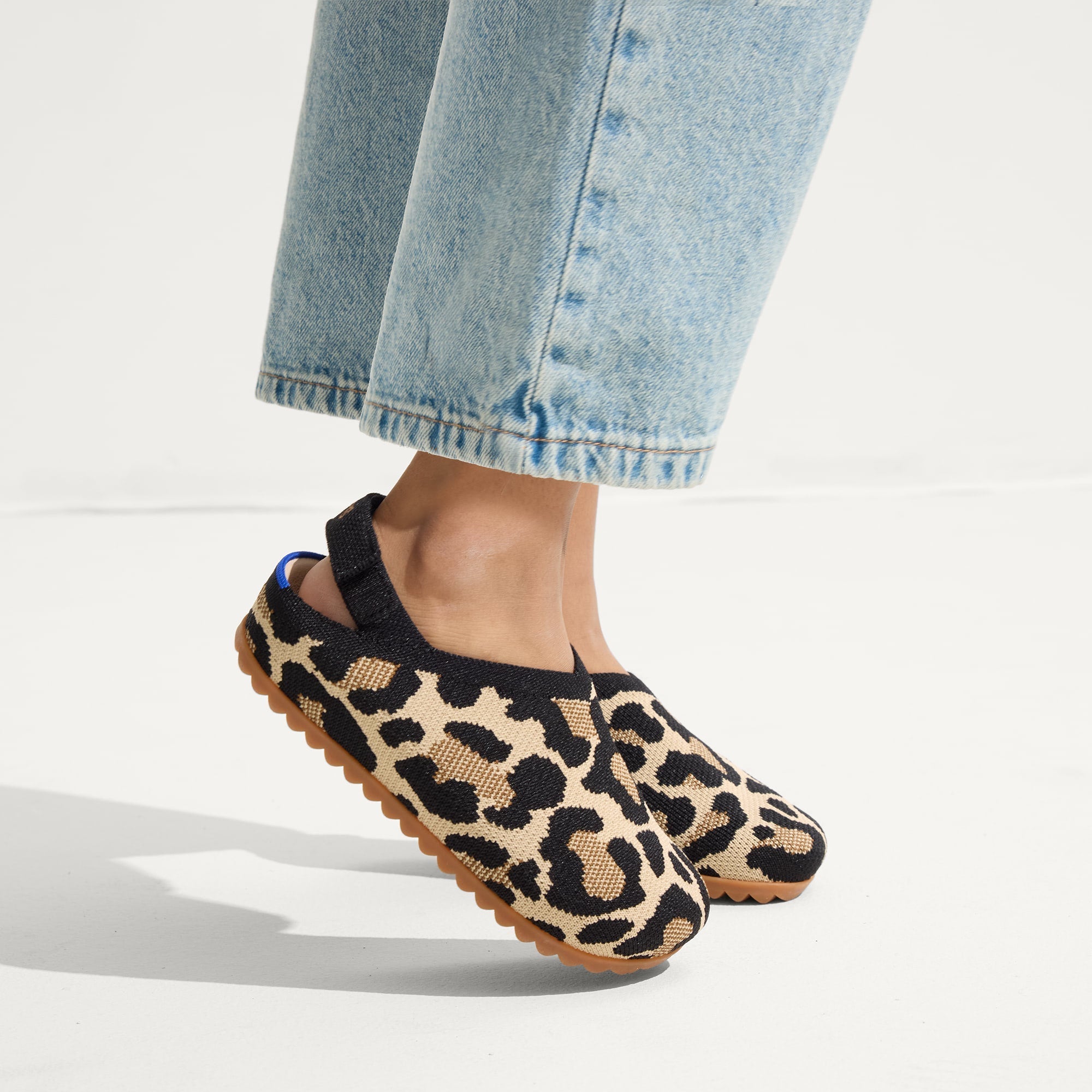 hover | A child wearing The Kids Clog in Desert Cat.