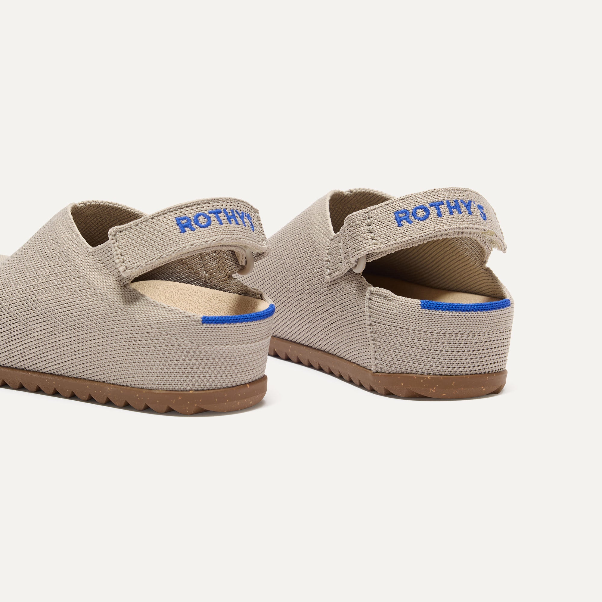 Close up of the heel of The Kids Clog in Dove, with Rothy's signature blue halo. 